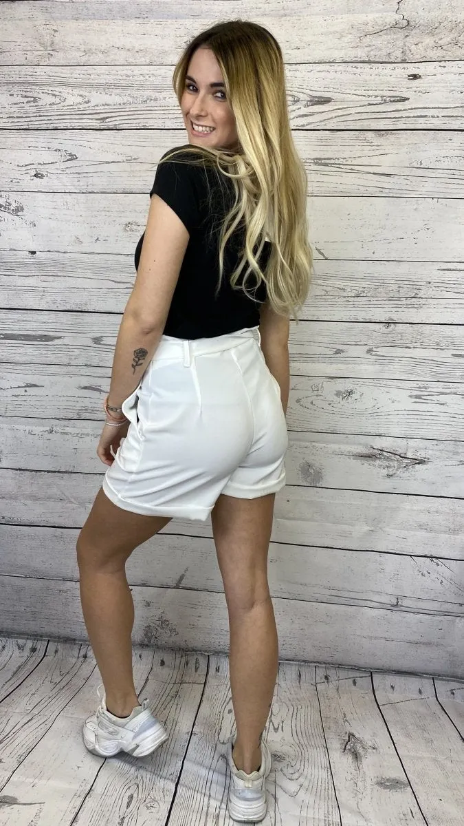 White drawstring shorts with contrasting buttons.